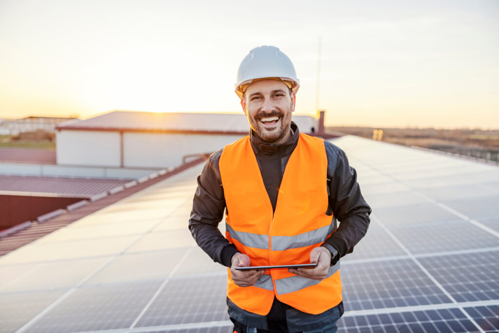 Solar Site Survey Technician Solar Career with iPad on Roof with Panels