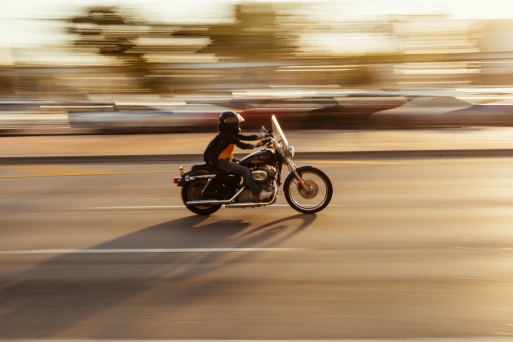 motorcycle driving on street blurry background