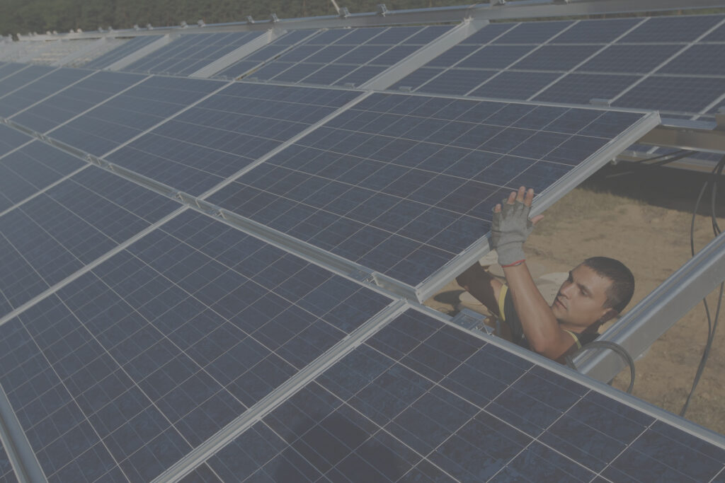 man holding solar panels