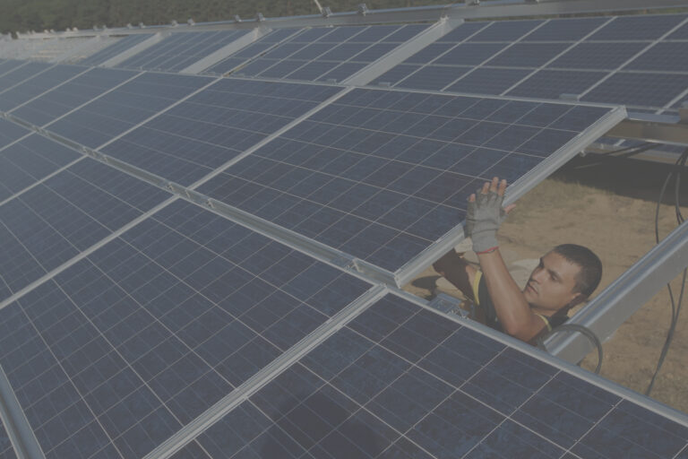 man holding solar panels