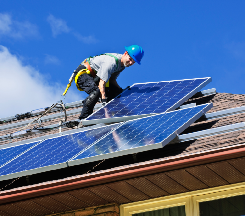 solar panels man installing on roof