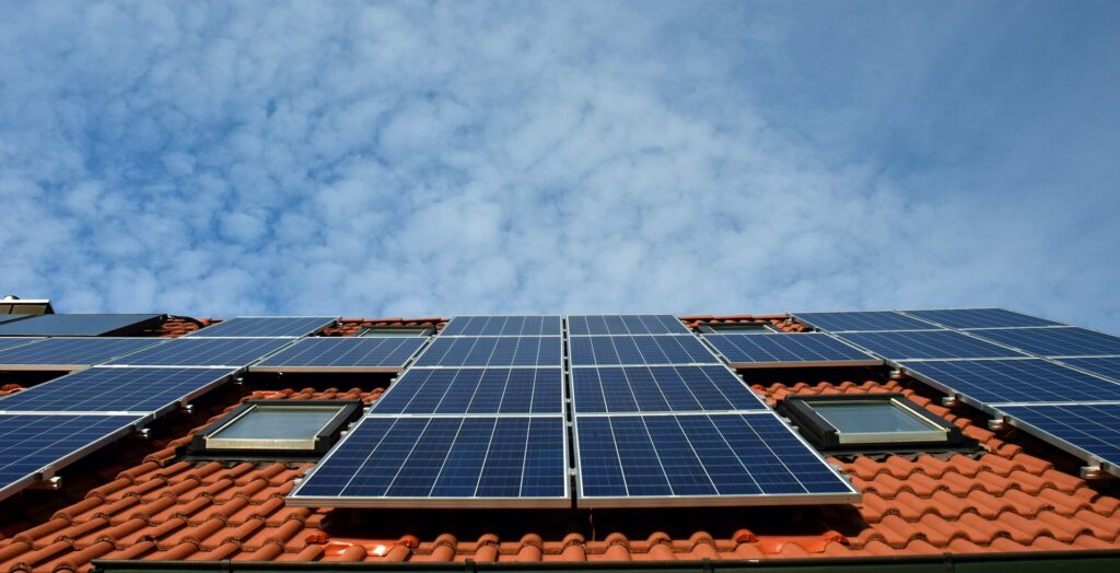 residential solar panels on roof blue sky