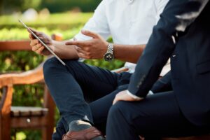 Collecting Insights Through Your Solar Field Service Software 41 business meeting two people sitting outside on a sunny bench