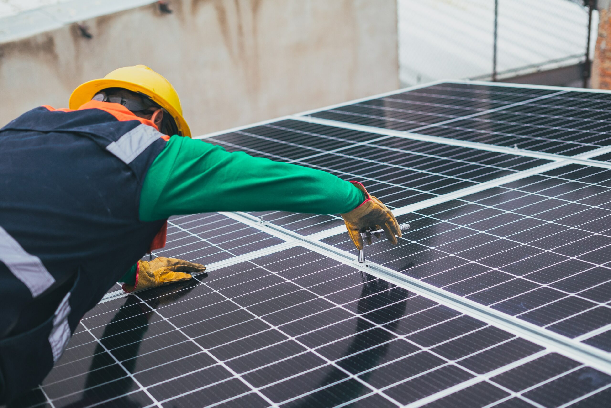 Use Case - Solar Service Software 57 solar panel installer hard hat roof