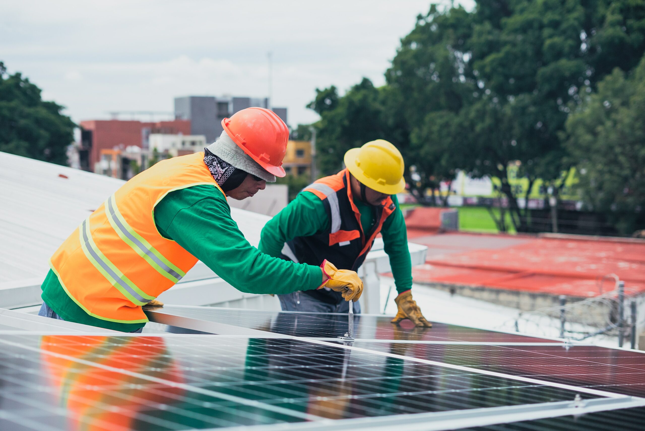 solar panel installers hard hats construction