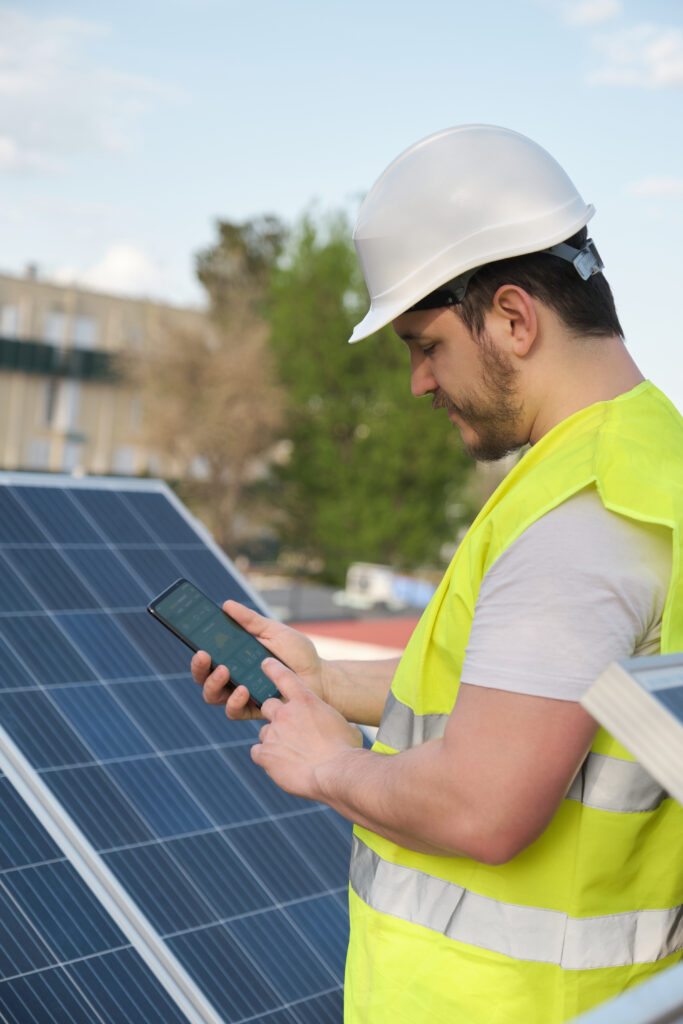 solar technician holding mobile phone