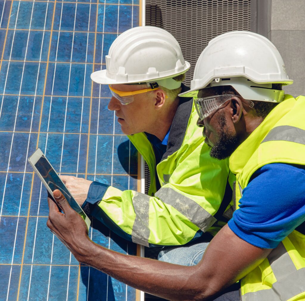 two solar field technicians tablet solar panels flipped cropped