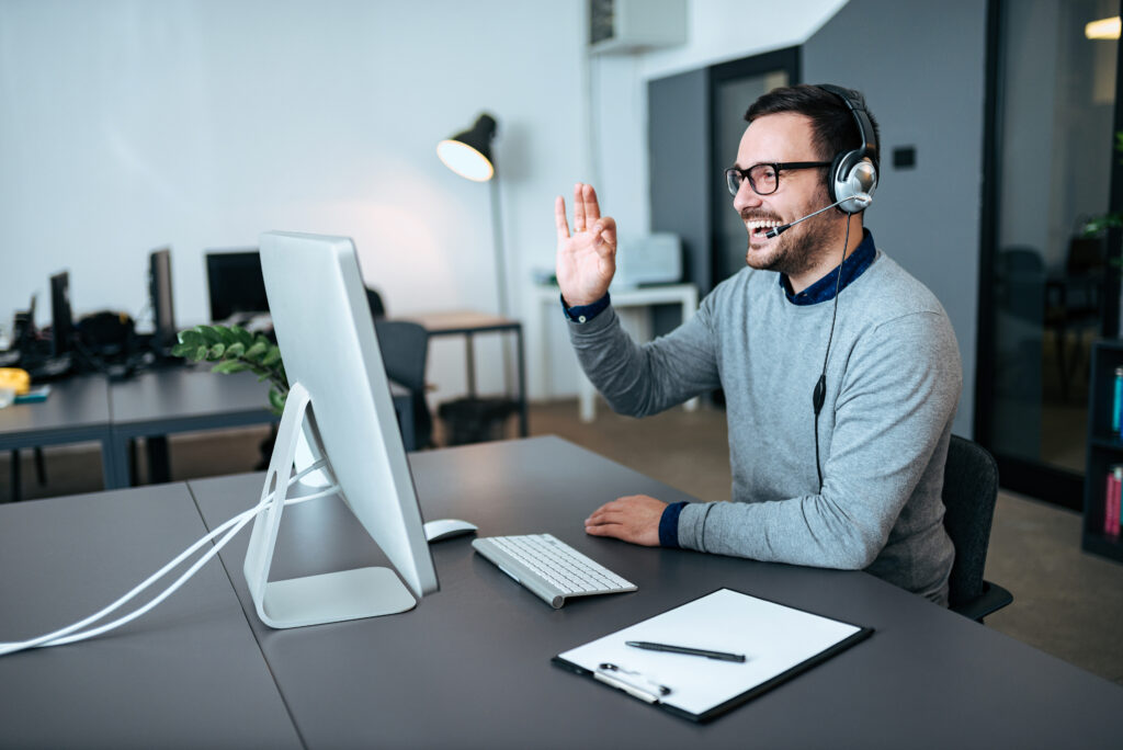 technical support integration specialist employee zoom conference call desk monitor