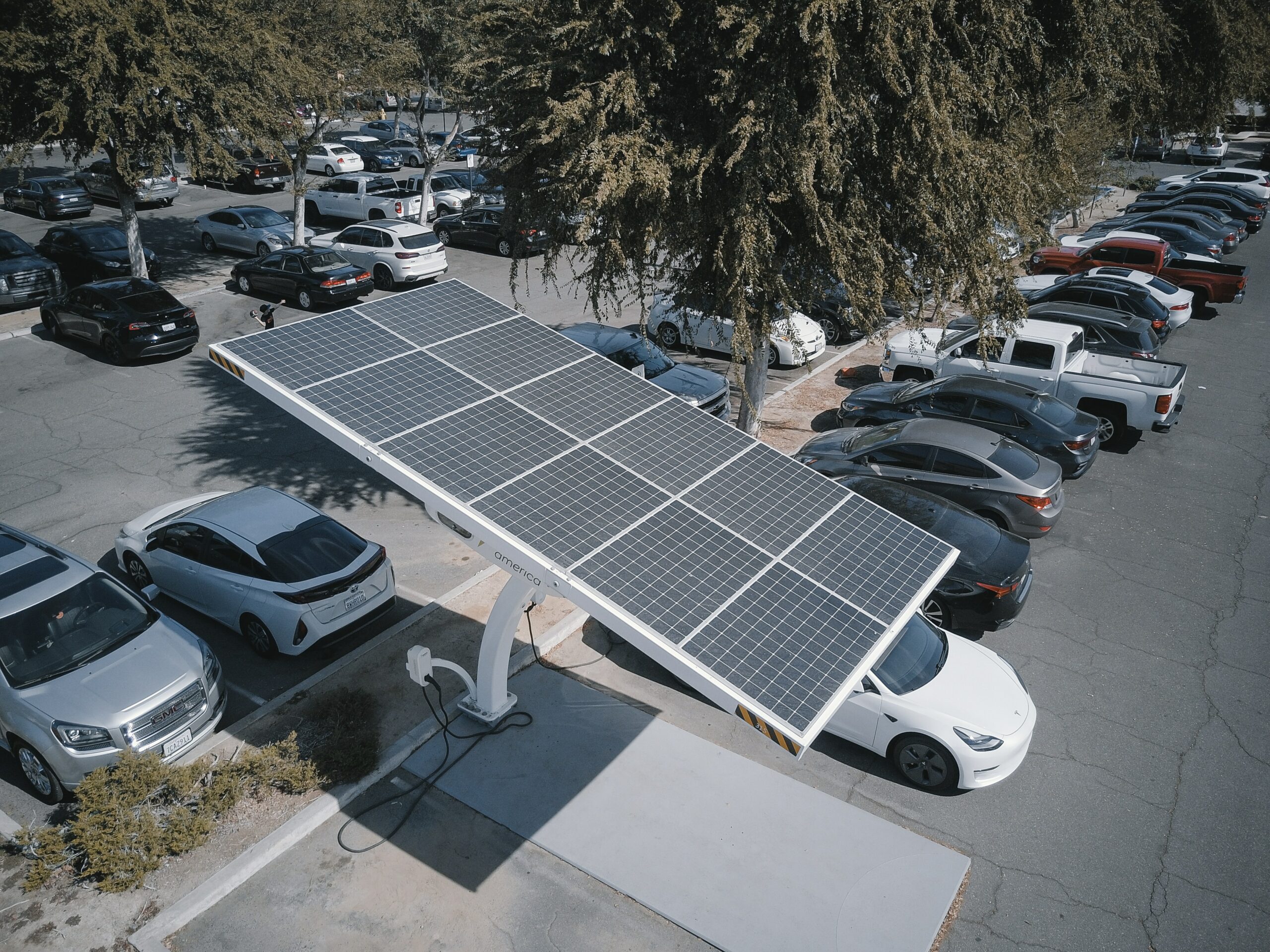 ev charging stations parking lot solar panels vehicles