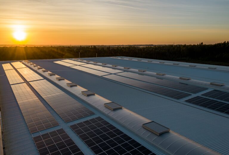 commercial solar project rooftop sunset