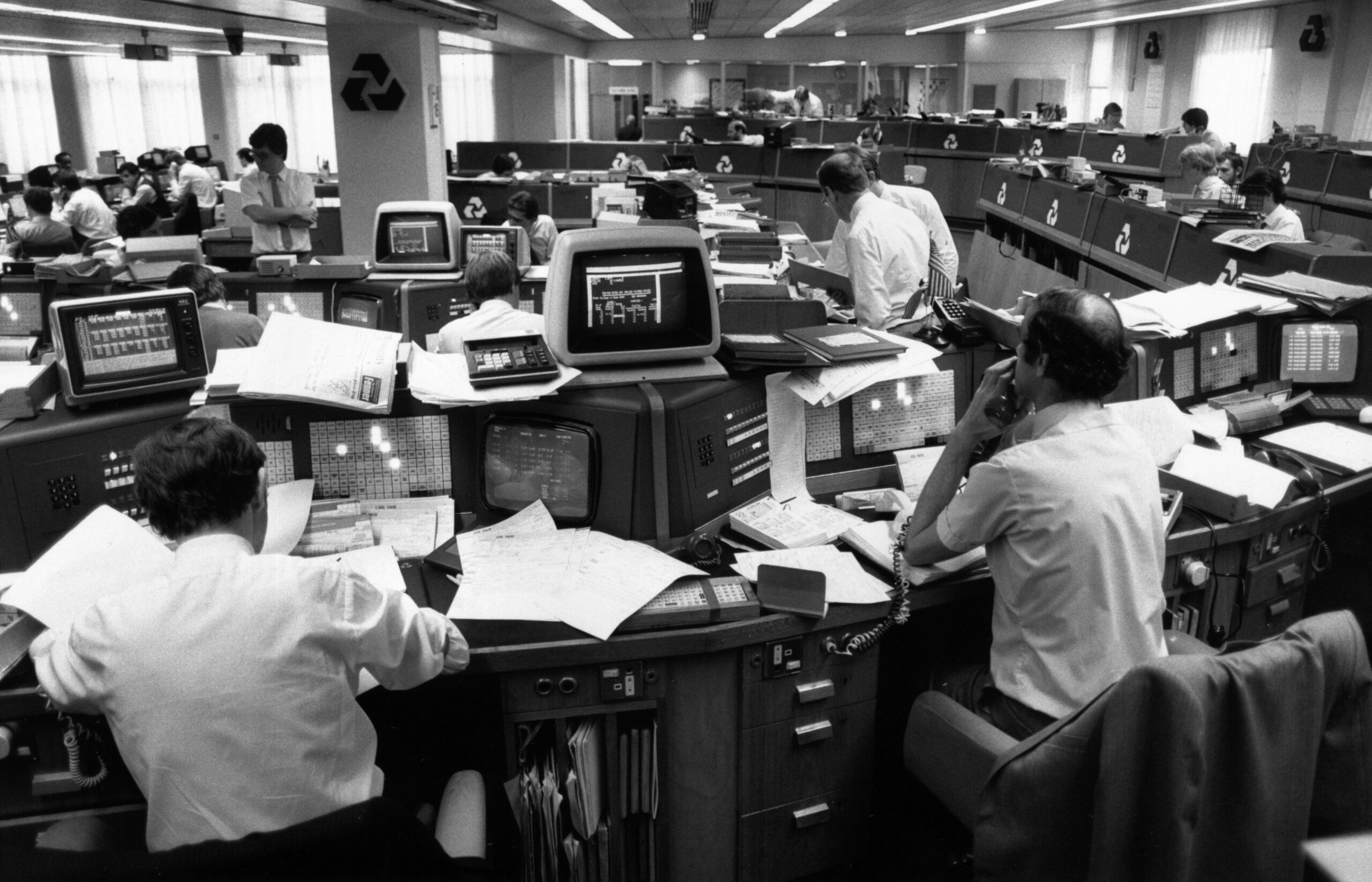 People at work on computers in an office at a National Westminster bank, circa 1990. (Photo by Steve Eason/Hulton Archive/Getty Images)