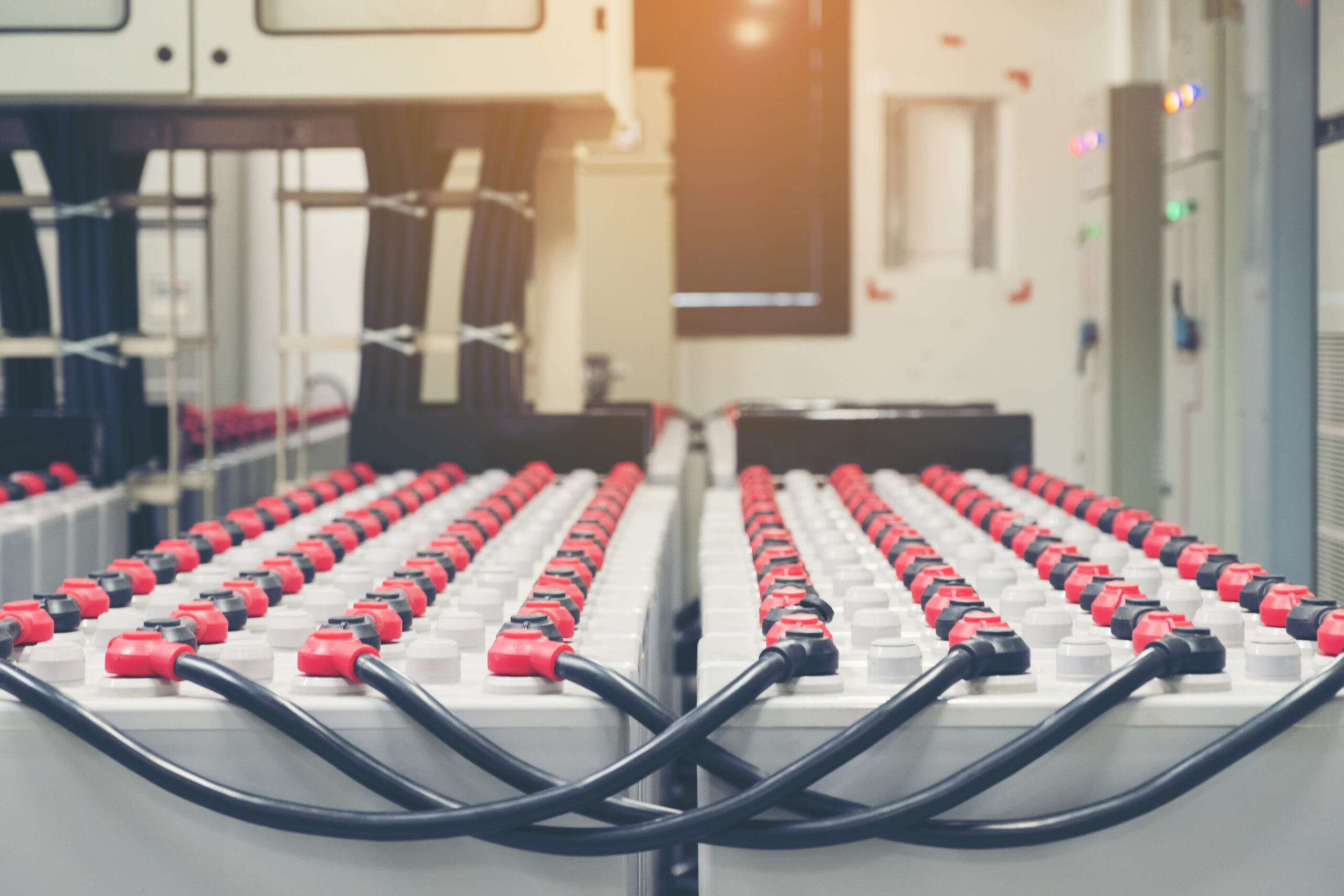 Battery storage in battery room in power plant for supply electricity in plant during shutdown phase, Rows of batteries in industrial backup power system.