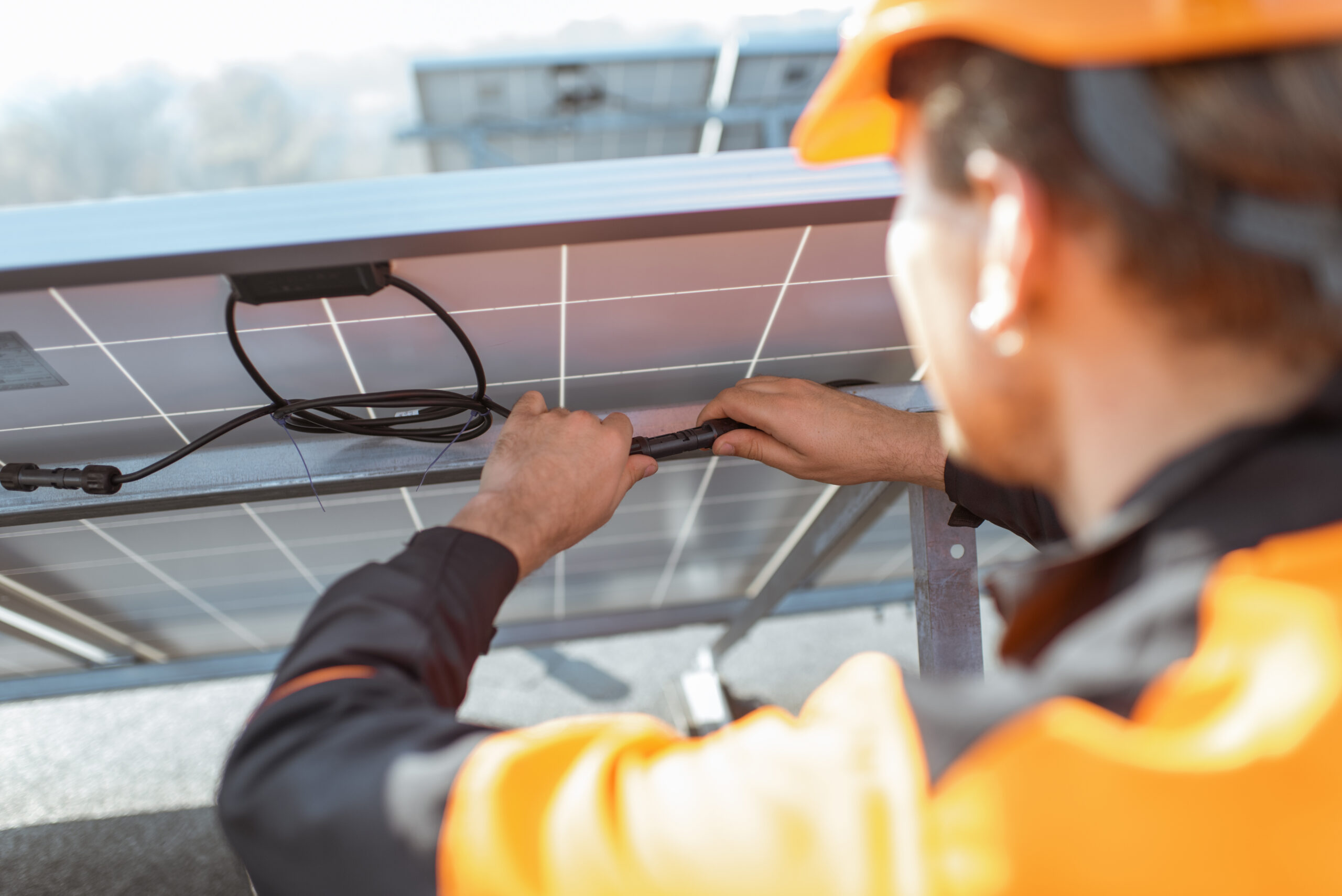 service technician repairing solar panel