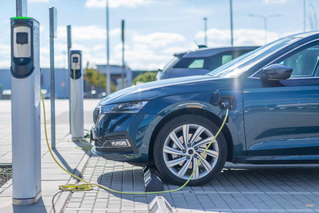 ev charging stations and car in parking lot