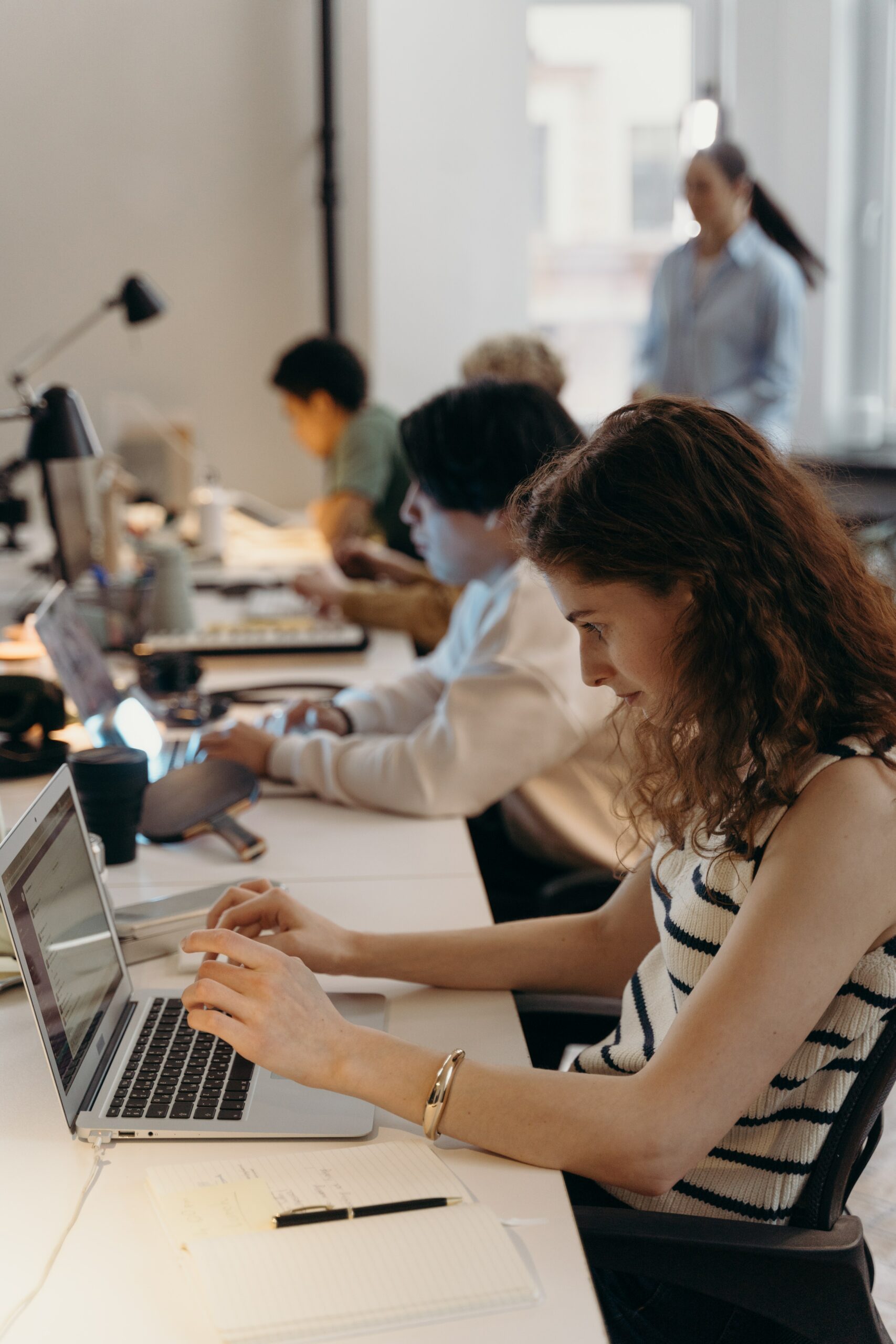 employees working on computers in office