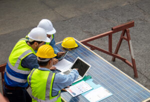 Renewable energy subcontractor project management field team laptop solar panels